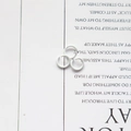 Detailed view of three white metal open jump rings for DIY jewelry craft making - White