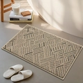 Minimalist beige and dark grey geometric chenille bath mat in a bathroom setting - Twill Rhythm