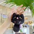 Detail of black plush cat keychain featuring pink paw embroidery and gold metal clip - Gold Lobster Clasp / Black