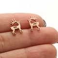 Detailed close-up of rose gold deer stud earrings held by hand showing the compact size - Rose Gold Running Deer (665)