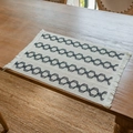 Bohemian linen placemat with navy interlocking chain patterns and handmade fringe edges - White with Black Hexagon