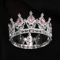 Detail of silver crown with pink teardrop gemstones and intricate floral engravings - Silver + Pink Drop