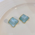 Square geometric gold-plated earrings with blue marble enamel finish on ceramic tray - Light Blue