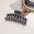 Close-up of a large matte dark purple shark hair claw clip for thick hair styling - Keel / Purple