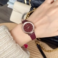 Close-up of a women's watch with burgundy leather strap and crystal bezel on wrist - Round Dial Inner Diamonds