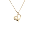 Close-up of golden heart pendant with MOM lettering and inlaid small zircon stones - MOM Heart White Zirconia