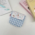 Close-up of quilted plaid mini pouch with a cute bear pattern and pink snap button - Snowflake Bear
