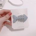 Fishbone hair clip in matte grey-blue finish on a white Korea display card - Gray