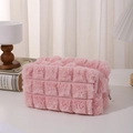 Close-up of pink plush pencil case with mesh texture and premium metal zipper detail - Pink