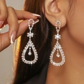 Sparkling silver drop earrings with crystal rhinestones on a female model - Silver Rhinestone Multi-Layer Long Drop Earrings DTE1416009S-W