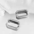 Silver rectangular hoop earrings with spiral texture on a reflective surface - Silver Spiral Textured Ear Buckle