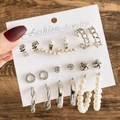 Close-up of 9-piece silver earring set featuring pearls and cubic zirconia on display card - 9 Pairs Set-Silver Zircon Pearl Combo