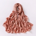 Close-up of salmon pink chiffon scarf with silky satin texture and soft draped folds - Rust Red