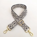 Detailed view of adjustable black and white jacquard bag strap with gold metal lobster clasps - Navy Blue
