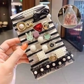 Set elastici neri per capelli con perle e ciondoli dorati in sacchetto a rete - Stile Nero / Set da 11 pezzi