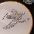 Pinza per capelli a stella marina argentata con strass e perle su piatto - Stella marina d'argento con perla bianca / Argento