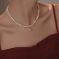 Close-up of double layer pearl necklace featuring a large oval pearl and gold clasp - 13# Necklace—Glass Bead Twist