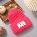Winter rabbit fur knit beanie in vibrant rose red with a stylish white decorative label - Rose Red