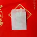 Detailed close-up of translucent parchment paper bag with a functional top flap lid - 9*10.5cm