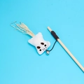Interactive wooden cat wand toy with white cloth mouse pendant and bell on blue background - Linen Flying Squirrel