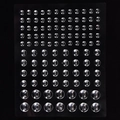 Macro view of transparent self-adhesive silicone bumper pads on a black background - MX-29 Transparent Beads