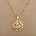 Macro shot of gold clover pendant with pavé set crystals and central round gemstone - Lucky Clover Necklace (D433)