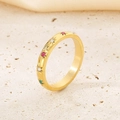 Macro shot of gold-plated stainless steel ring with colorful gems and starburst details - US 9 / Gold (KR1088282-GC)