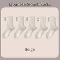 Five pairs of beige Japanese style slouch socks with vertical ribbed knit texture - One Size / Beige