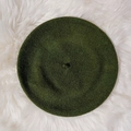 Classic dark green wool beret for women on a white faux fur background - M / Army Green