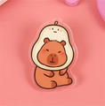 Cute capybara acrylic badge wearing an avocado hat on a vibrant pink background - No.3 Capybara