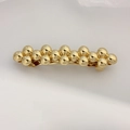 Elegant gold spherical hair clip featuring a layered metal ball design with spring clamp - Polished Bubble Cluster Gold