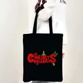 Black canvas tote bag with red Merry Christmas lettering and festive holiday elements - Style 19-Festive Elements Christmas