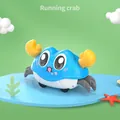Running bubble crab toy in sky blue and white with yellow claws and black wheels - OPP Bag / Blue