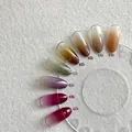 Gradient nail polish set with 8 colors including purple and green on acrylic display - Xijiangyue Patting Gel (set Of 8 Colors) Comes With A Box Of 20 Tofu Blocks.