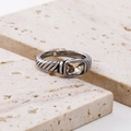 Macro shot of rectangular champagne gemstone with vintage cable pattern band ring - Steel Champagne Zirconia