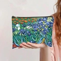 Detail showing hand holding a Van Gogh Iris print canvas pouch with top zipper - Van Gogh Irises Oil Painting Style (jiayingpbb0281)