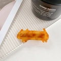 Tortoiseshell acetate calico cat hair clip with gold facial details on white background - Orange Yellow