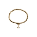 Gold beaded bracelet with sparkling colorful zircon letter Z pendant on white background - Letter Z