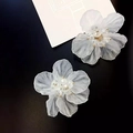 Elegant white translucent layered flower earrings with gold stamens on black background - Layered Matte Petal Style (E1360)