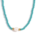 Beaded necklace with teal faceted beads, gold accents and a white freshwater pearl - Turquoise Jade-like Beads