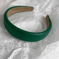 Close-up of deep green lychee textured leather headband with soft non-slip suede lining - Dark Green