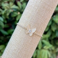 Detail of 18k gold butterfly bracelet with pavé cubic zirconia on a rustic linen stand - Pear-cut Center Zircon Butterfly(4)