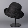 Close-up of black Lyocell linen sun hat featuring a side bow and white bead accents - Black / M(56-58cm)