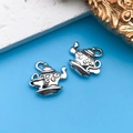 Vintage silver teapot charms with floral relief for DIY bracelets on blue background - Teapot Coffee 15x14mm