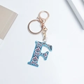 Letter F keychain with blue border and paisley floral pattern on a gold lobster clasp - Letter F (No Tassel)