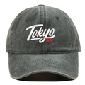 Macro detail of high-quality Tokyo 3D embroidery on vintage washed cotton baseball cap - Green