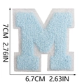 Macro detail of blue towel embroidery letter M patch with precise size measurements - Letter M / Light Blue