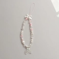 Beaded phone charm with white bow, pink mermaid tail pendant and faux pearls - Fish Tail Style Phone Chain