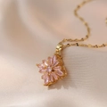 Elegant gold titanium steel necklace featuring a rotating pink crystal flower pendant - Petal Necklace Style (X0743) / Pink