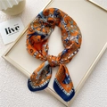 Elegant 70cm square silk scarf with exotic floral bird print in orange and navy blue - Samsara Orange